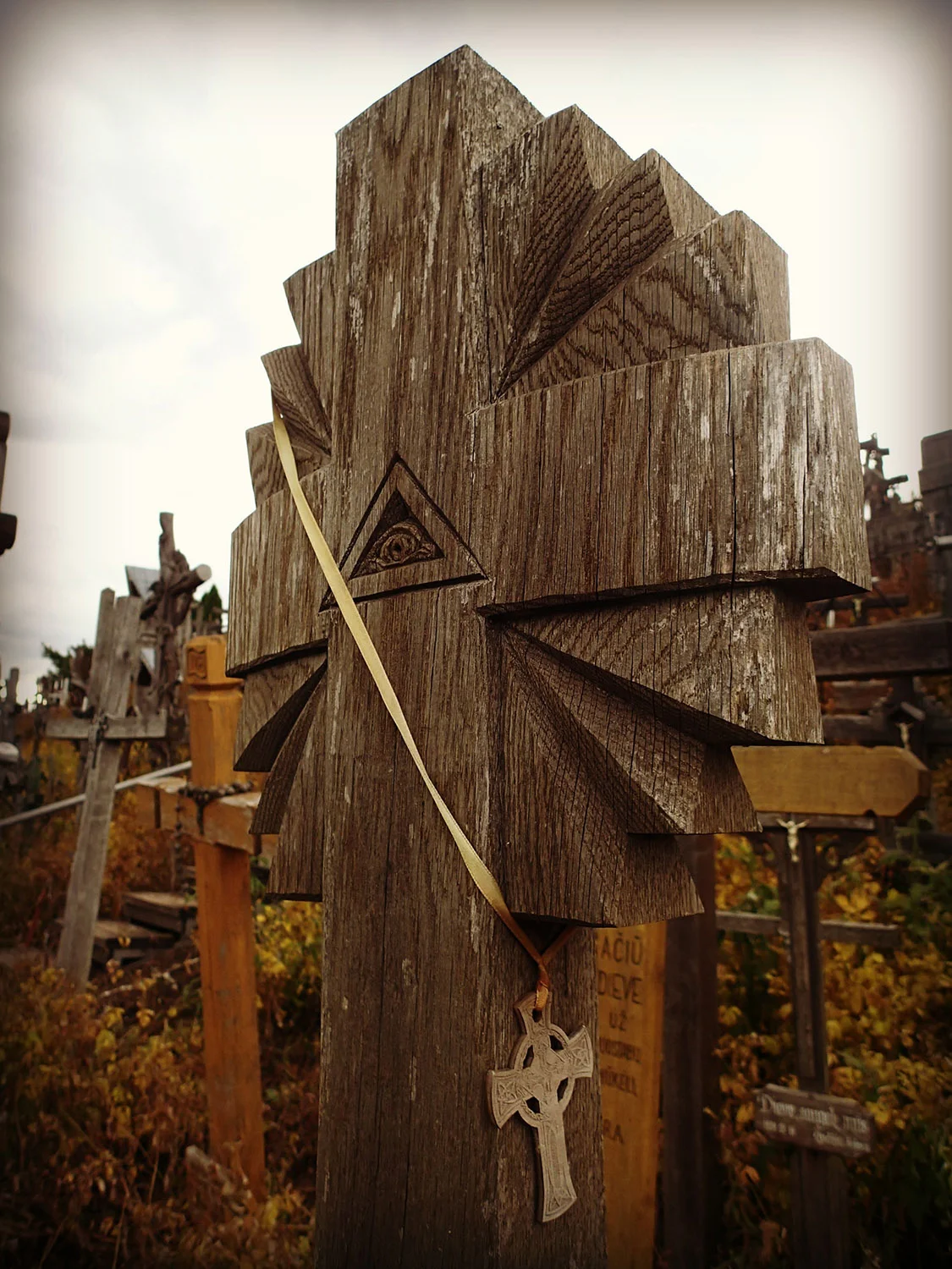 In local lore, the all-seeing eye on the cross symbolizes the 'eye' of God, keeping watch on mankind.
