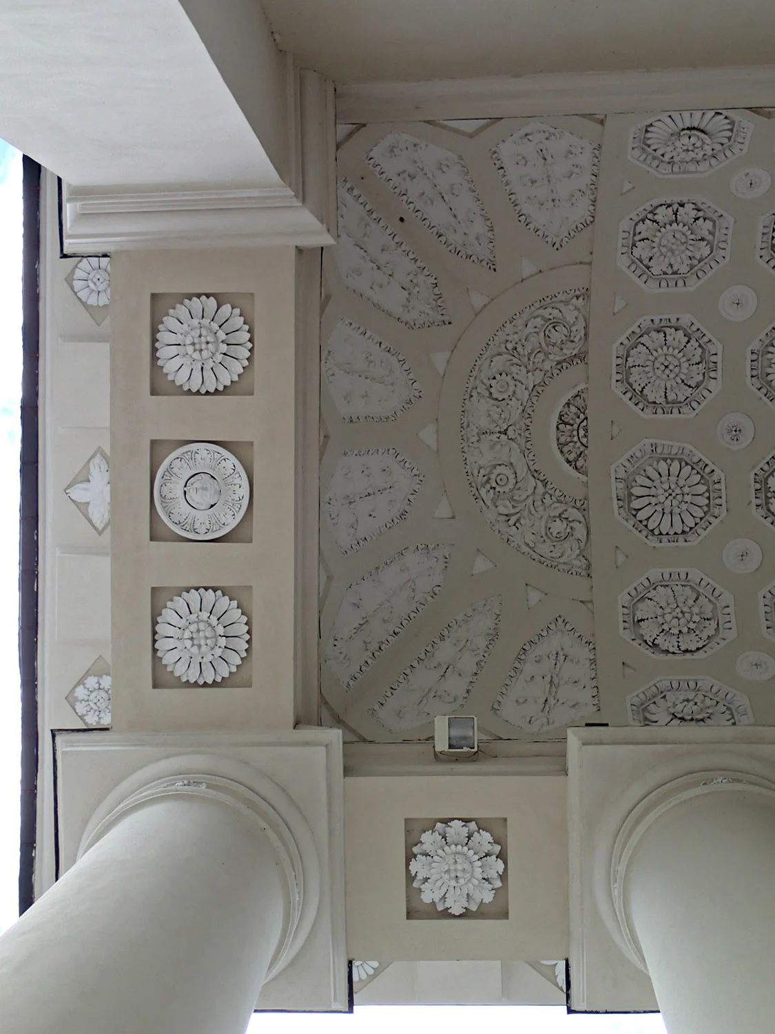 The white on cream neoclassical ceiling of the Vilniaus Šv. Stanislovo ir Šv. Vladislovo arkikatedra bazilika (Vilnius Cathedral Basilica of St Stanislaus and St Ladislaus). Inside the cathedral's crypts & catacombs are buried many famous people from Lithuanian & Polish history along with the heart of a Polish king.