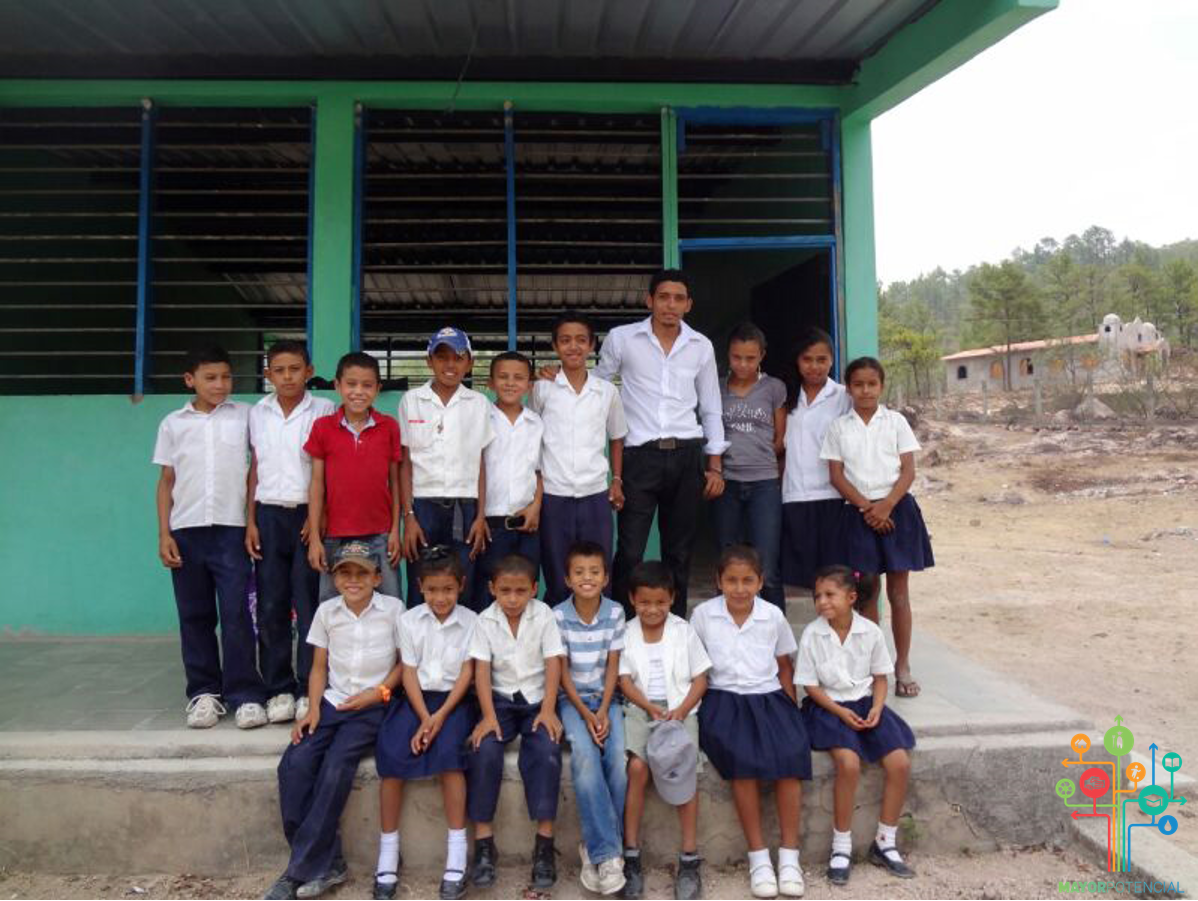 Children Pose in Front of Their Classroom