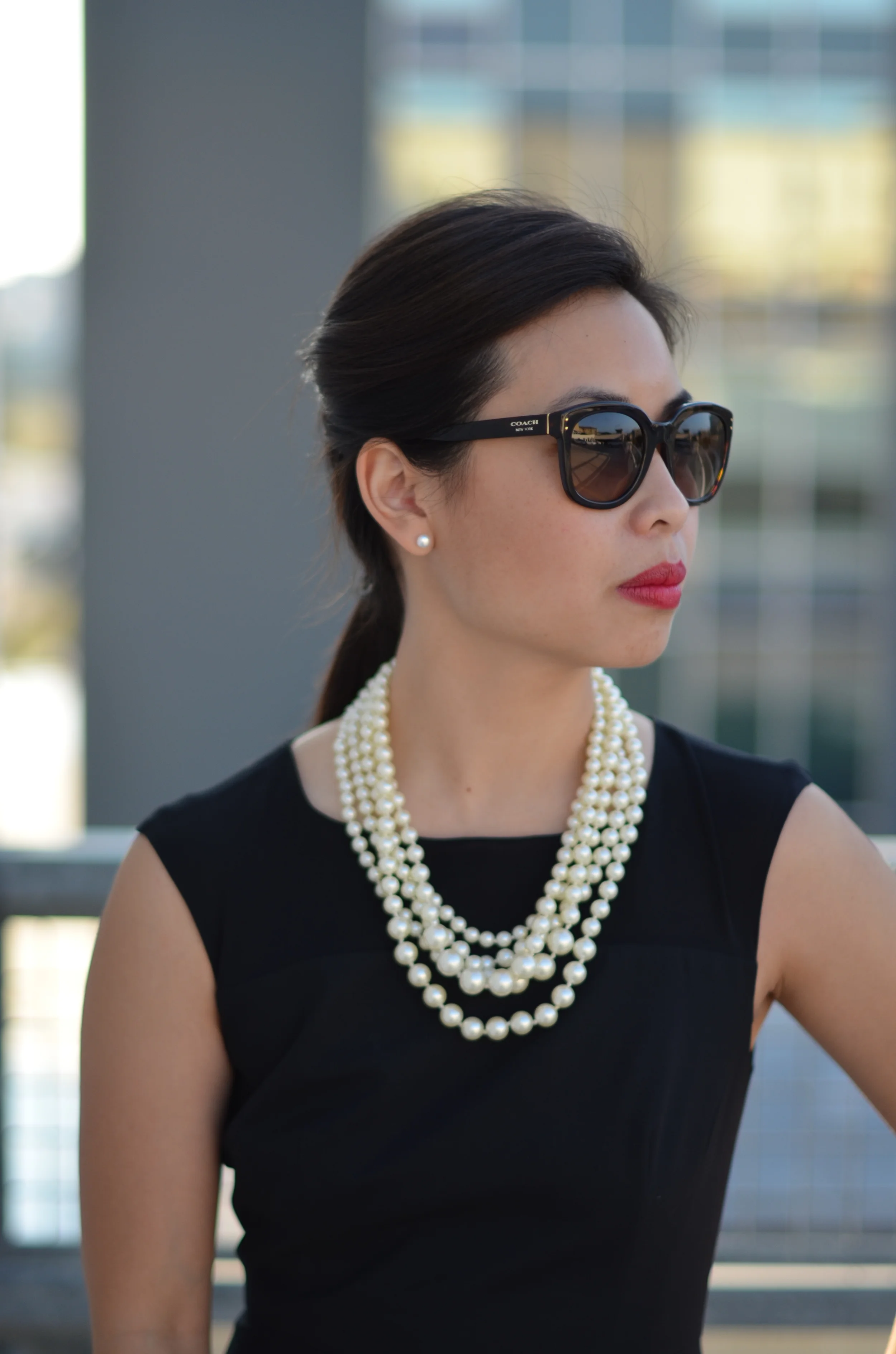 black dress with pearls