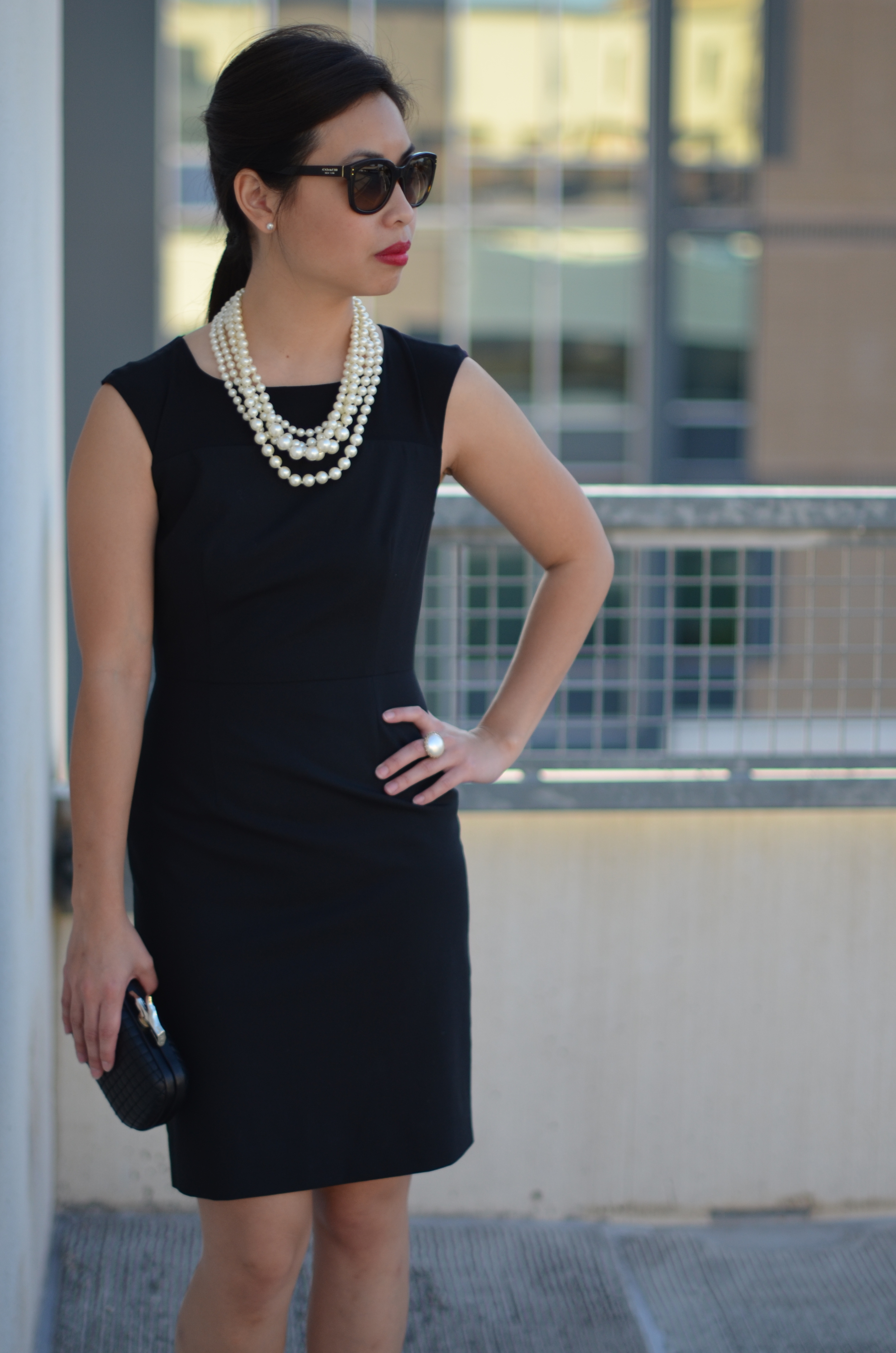 black dress with pearls