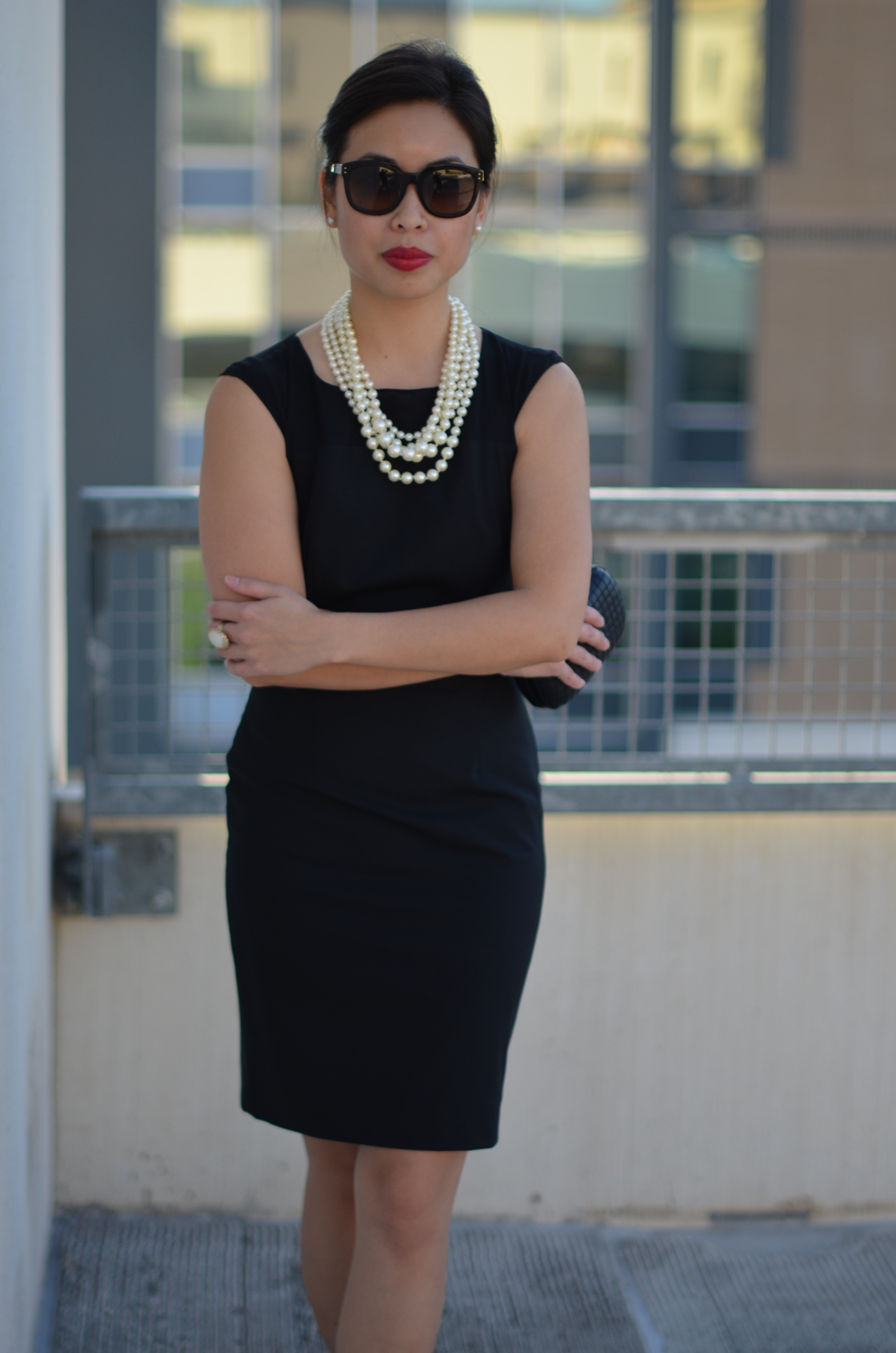 black dress with pearls