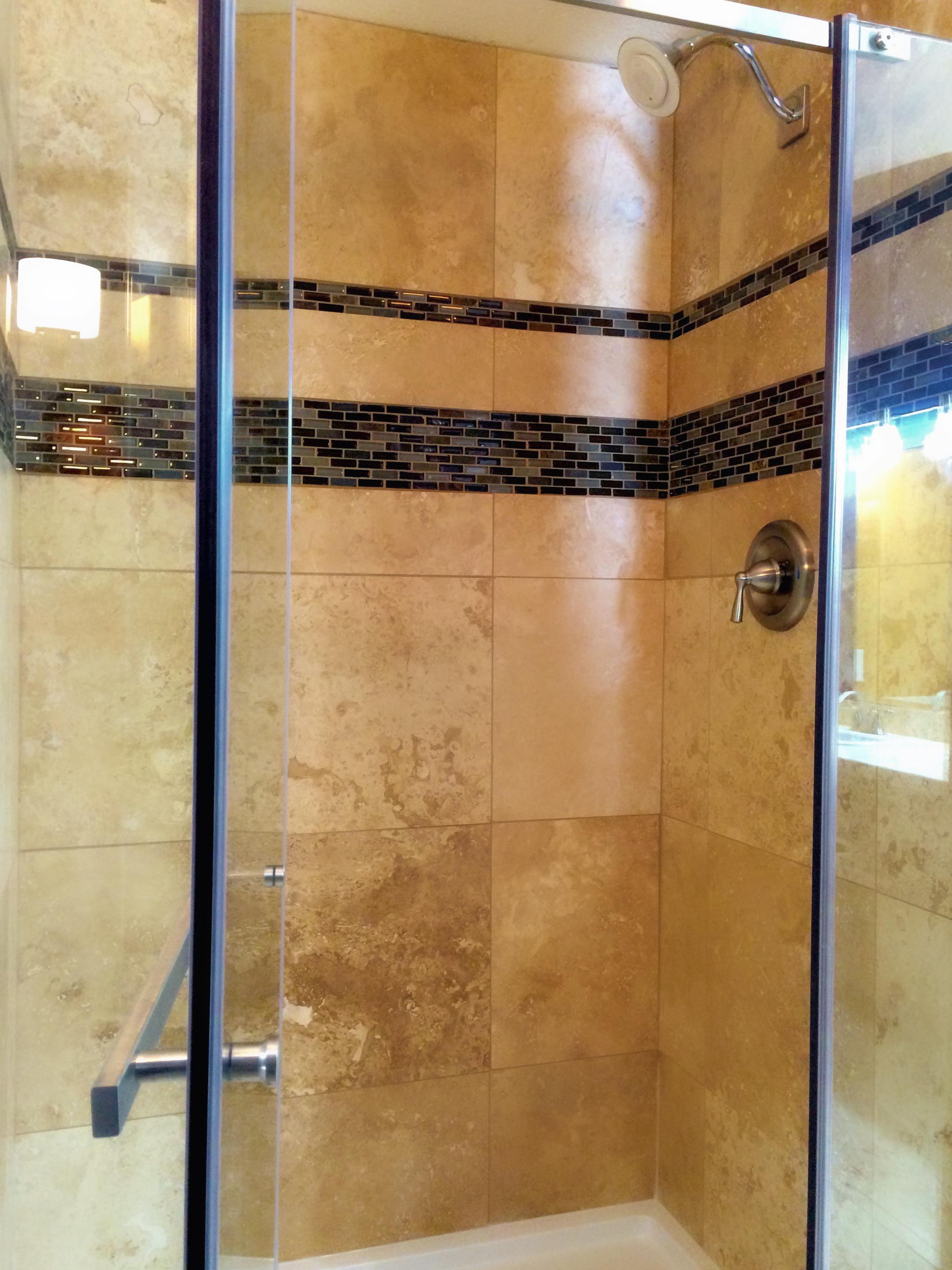 Updated Master Bath, includes shower with travertine & Kohler Moxie Bluetooth Speaker