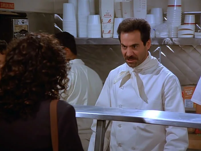 The folks at Joey's are friendly, unlike the Soup Nazi (above) in the episode. There's just not a lot of time to decide what you want. No in-depth discussions about the ingredients in the lasagna? No waffling over the sausage or veggie slice. You must order. Order quick. Then move along.