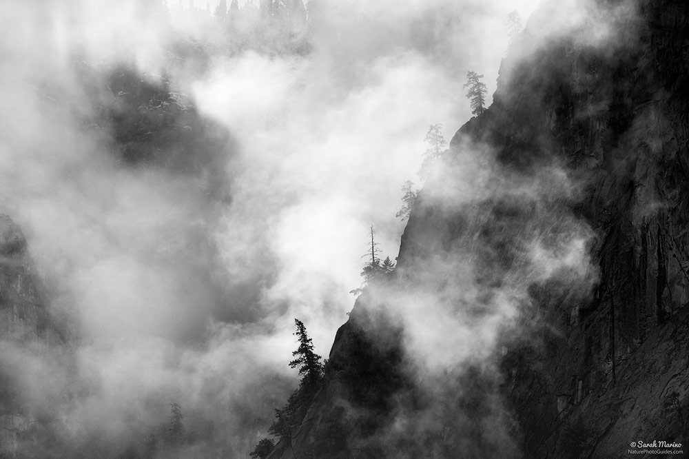 A storm clears from the high cliffs surrounding Yosemite Valley in Yosemite National Park, California.