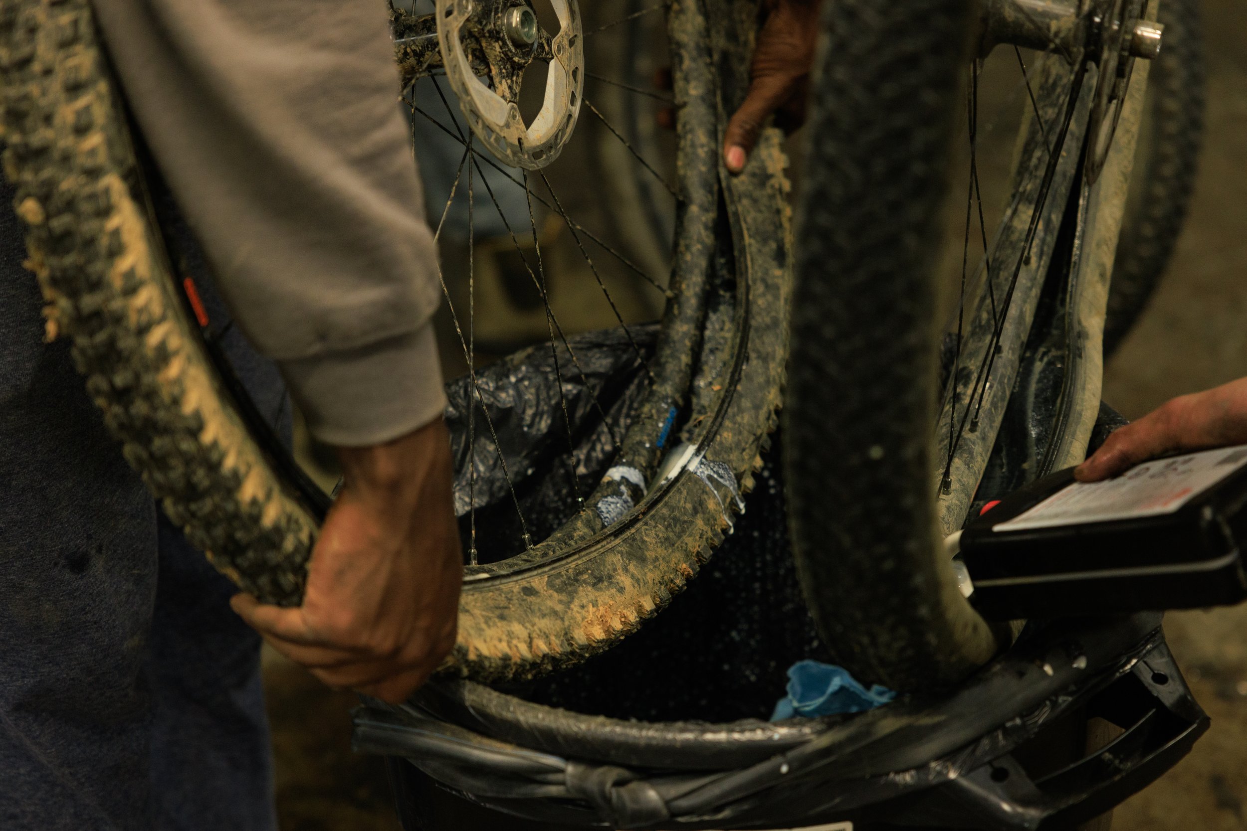 Korey adds sealant to a tire