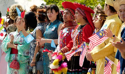 UN staff members dressed in their national costumes celebrate UN Day