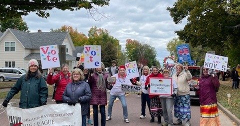 League Members Marching in Bayfield Apple Festival Parade. Your Vote is Your Voice - Register and Vote in the Nov 5th Election.