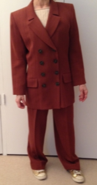  Suit is overpowering and outdated.