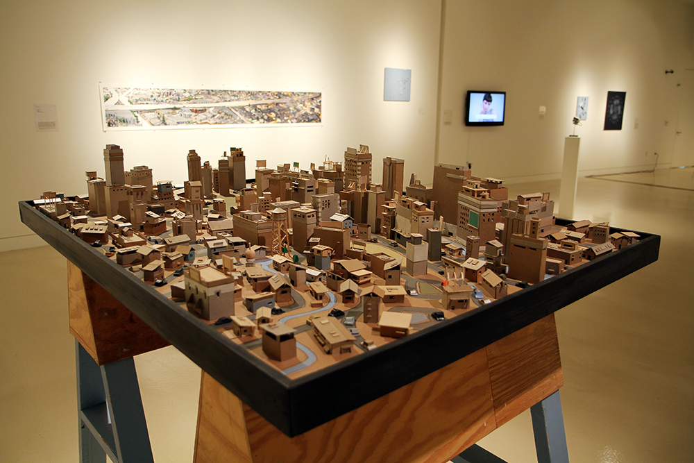  Kiel Johnson  Urban Sprawl Project: River Front  2013 Chipboard and balsa wood 48 x 60 x 60 inches Courtesy of the Artist and Mark Moore Gallery 