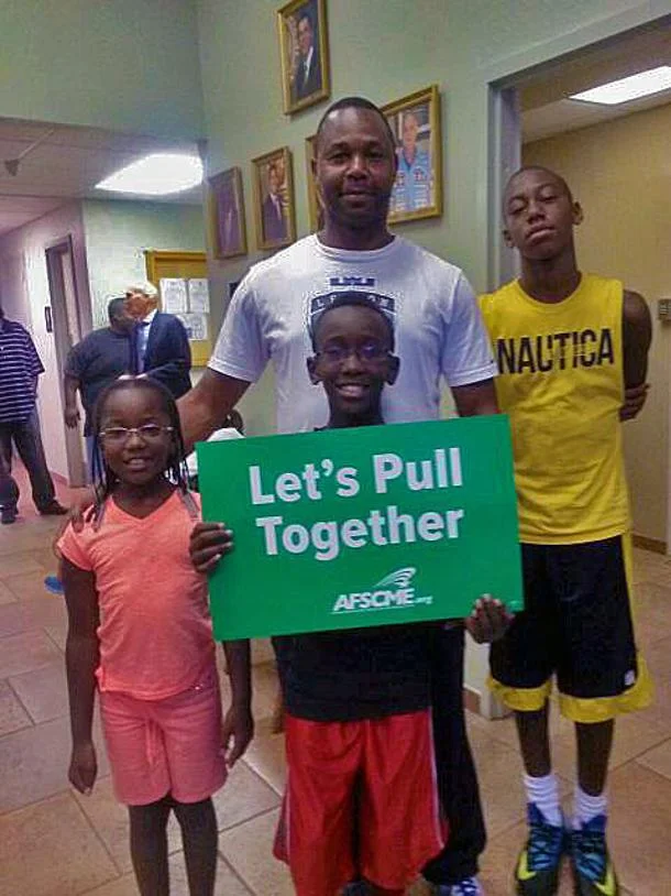 AFSCME Local 3294 member Randolph Brown and his family attended the Commission meeting.