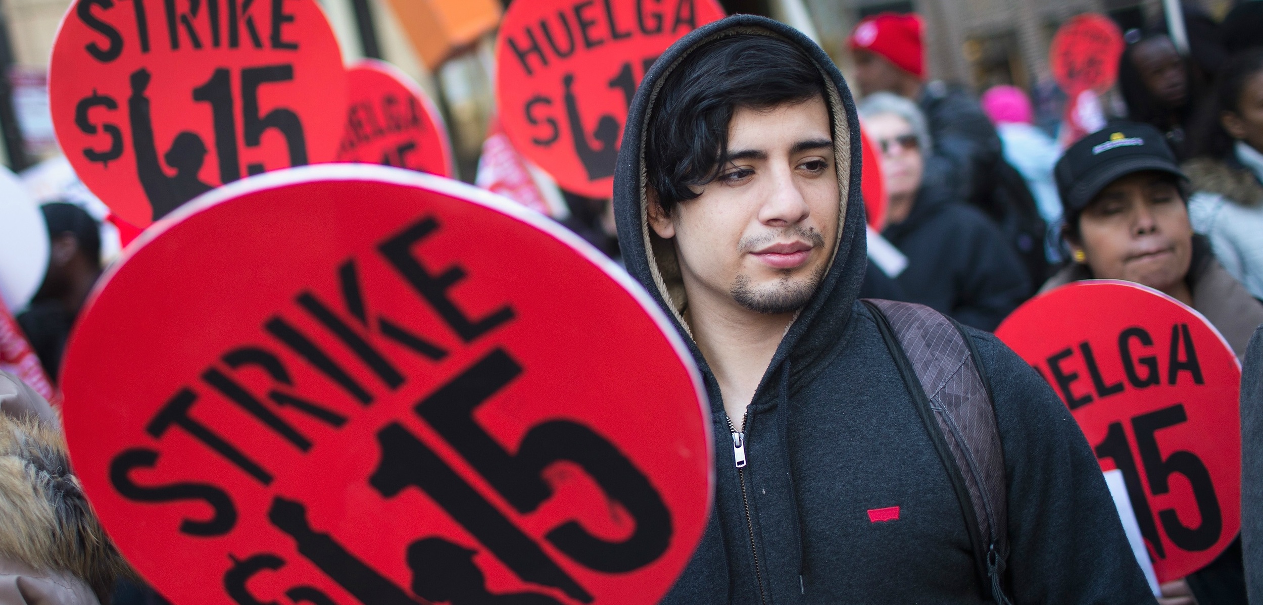 Demonstrators demand an increase in the minimum wage to $15 per hour in Chicago on April 14. Photo credit: SCOTT OLSON/Getty Images