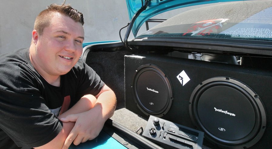June 2, 2016, Vista, California, USA_| Billy May-Hatch shows off the high end stereo speakers he installed in his car that's parked at North County Tech High School in a small Vista industrial complex. He graduates this week and earned a pre-apprentice diploma that allows him to get an apprenticeship in the electrical business. | Mandatory Photo Credit: Photo by Charlie Neuman/San Diego Union-Tribune/©2016 San Diego Union-Tribune, LLC San Diego Union-Tribune