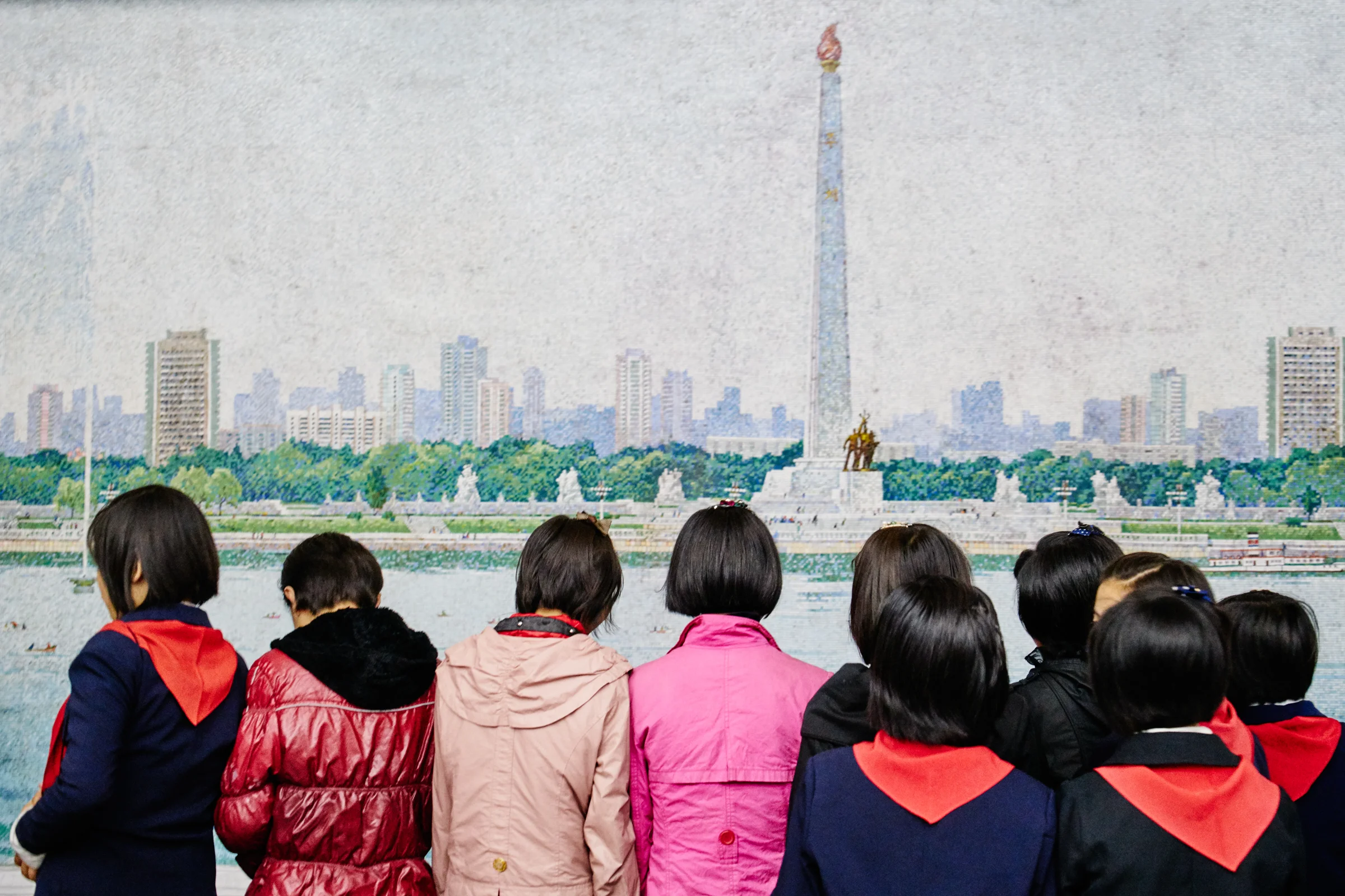 School children wait for the train inside Pyongyang metro station. 
