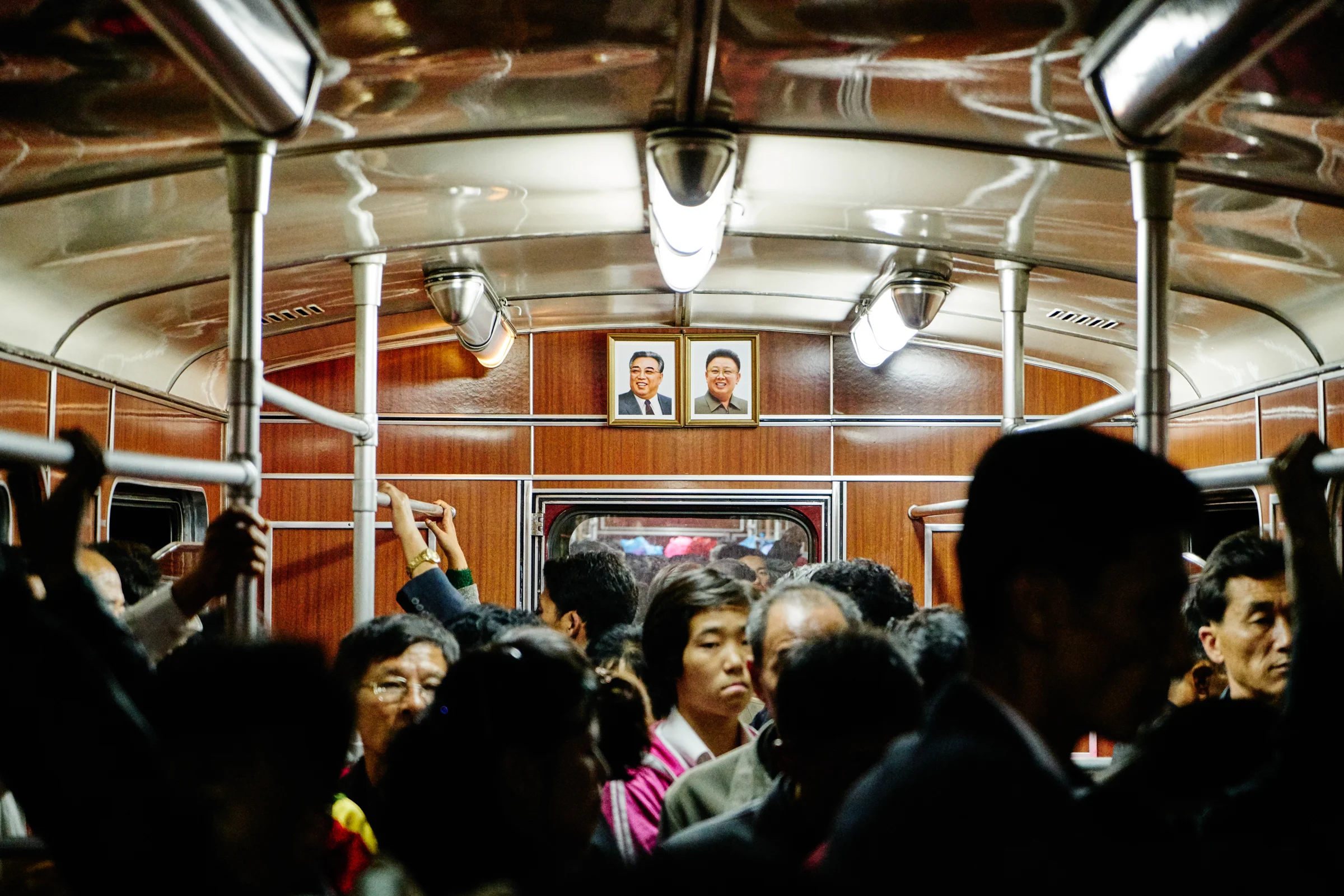 A photo of Kim Il-Sung and Kim Jong-Il hang in every metro car in Pyongyang. 