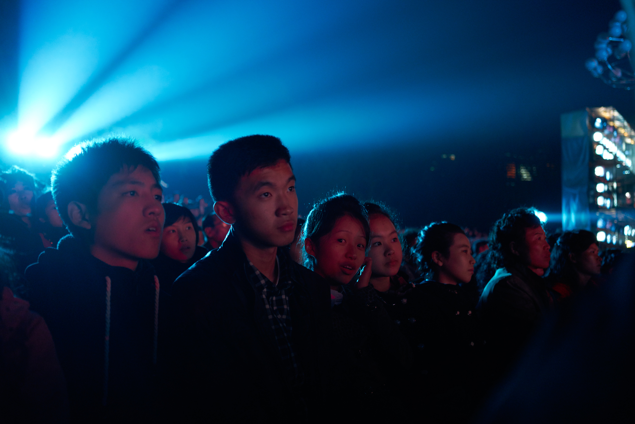 Locals attend the 70th Anniversary concert outside the waterfront of Kim -Il Sung Square. Pyongyang, NK