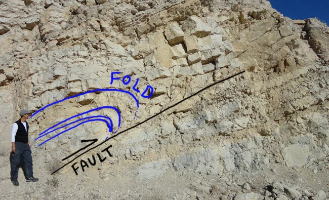 Josh Villolobos observes folding and faulting at Cristo Rey. Picture from Joshua Benton, Geology of Cerro Cristo Rey