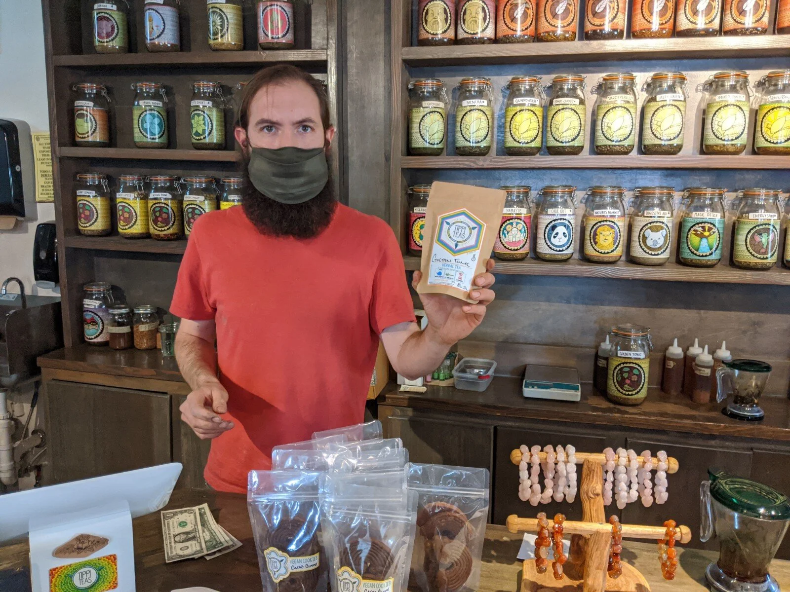 Jose Murguia holding up the Golden Tonic Tea that he just sold me.