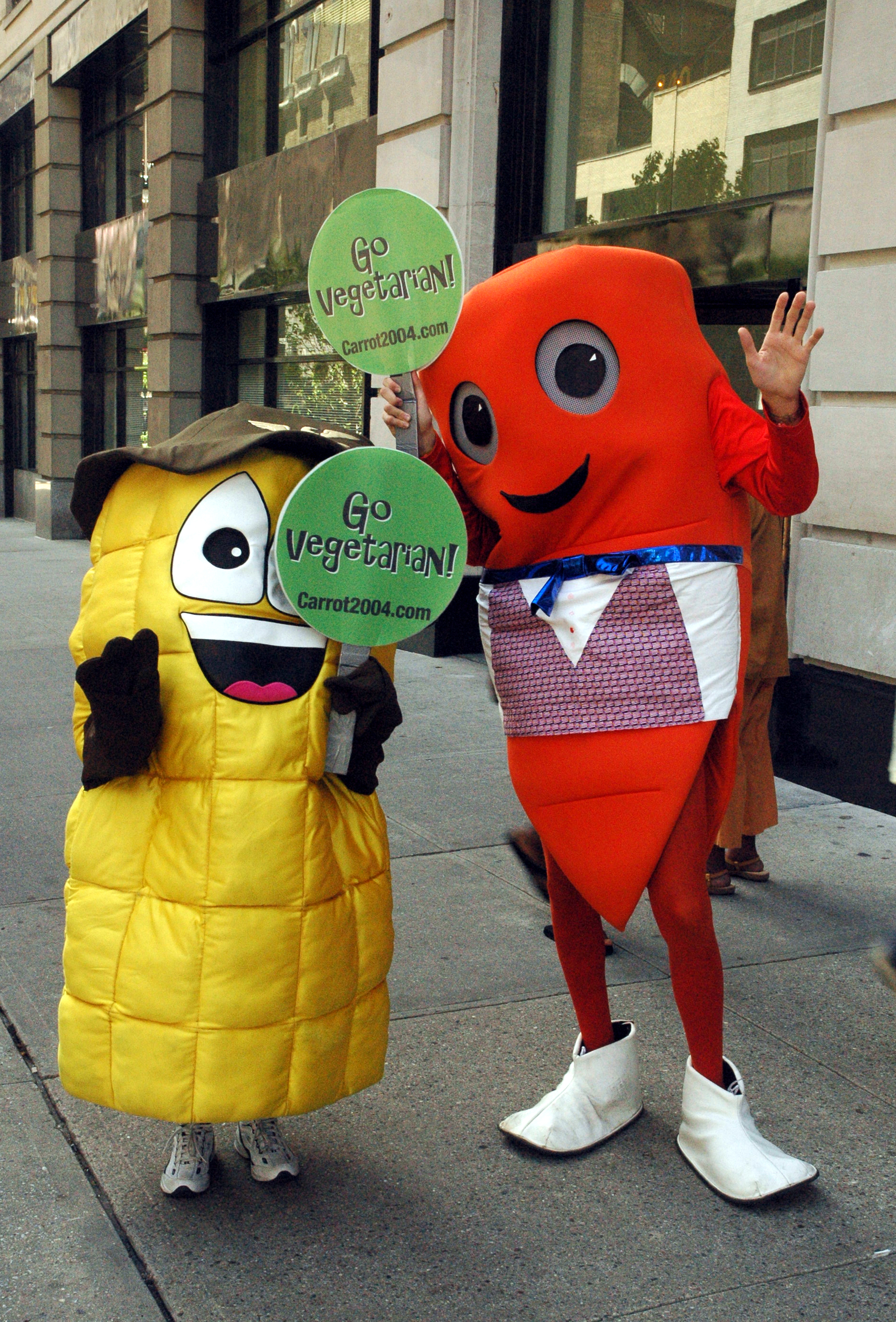 Two cartoon characters pose for photos on 34th Street near t.JPG