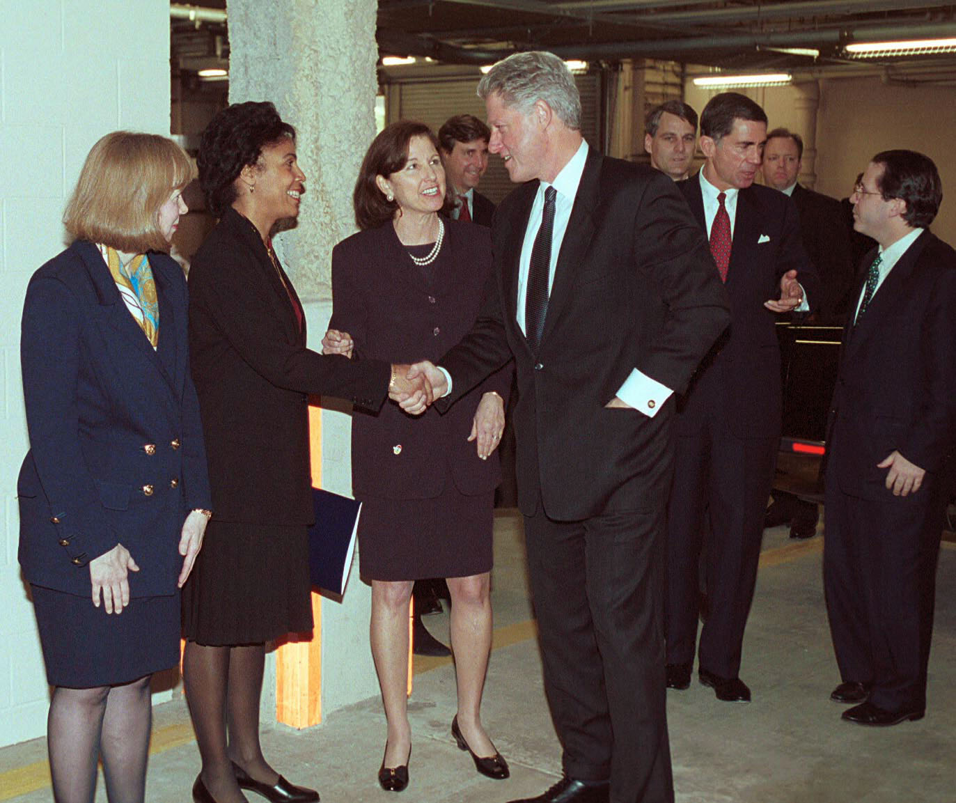 17. President Clinton greets three AT&T Vice Presidents in Oakton, Va.jpg
