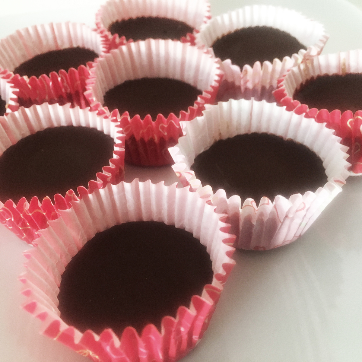 Dark Chocolate Almond Butter Cups Cup Ingredients: 3/4 cup cacao paste 1/2 cup cacao butter ½ - 1 cup maple syrup (adjust according to desired sweetness) 1/8 teaspoon sea salt A few drops stevia (optional) Filling Ingredients: 1/2 cup raw almond butter 2 teaspoons coconut sugar 1 teaspoon lucuma powder 1/4 teaspoon of sea salt Directions: Place cacao paste and cacao butter in a double-broiler to melt. Remove from heat and stir in maple syrup. Pour 2 teaspoons (for large cups) or 1 teaspoon (for small cups) of the chocolate into each cup of a lined cupcake tin. Sprinkle with sea salt. Place tin in freezer for 30 minutes. Mix filling ingredients together in a bowl. Remove tin from freezer and scoop almond butter filling, adding 2 teaspoons (for large cups) or 1 teaspoon (for small cups) to each cup. Place tin in freezer for 30 minutes. Remove tin from freezer and pour remaining chocolate into each cup, covering the almond butter filling. Sprinkle with sea salt. Place tin in freezer for at least 6 hours before serving. Allow to warm to room temperature (5 - 10 minutes) for best flavor. Yields: 6 large or 12 small cups If you liked this recipe...consider joining the Thryve Studio DIY Chocolate Truffle Making class happening this weekend. Perfect Valentine's activity to celebrate the occasion. See flyer for sign up details below. 