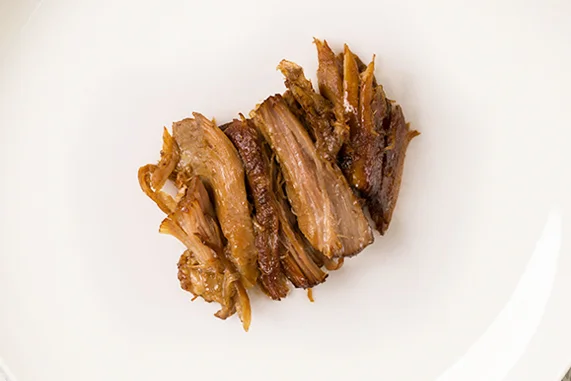 braised pork hock Pork hock is another vastly undervalued cut that’s a luxury in Northern China. Like the beef, the pork is braised gently on the bone in a sweeter liquid of brown sugar, bay leaves, ginger, and fennel. After it rests overnight, the pork is deboned, chopped up with the skin and served warm.