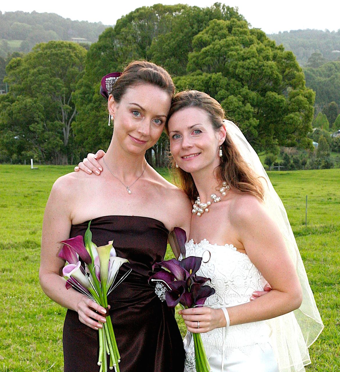 My sister (on the left) and I (the bride). * Please note my blood shot eye. Being a bride is VERY exhausting and I also cried when I saw my wedding bouquets because they were so beautiful. A tad emotional?