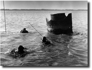 USS Harvest Moon, the smoke stack can be seen at low tide