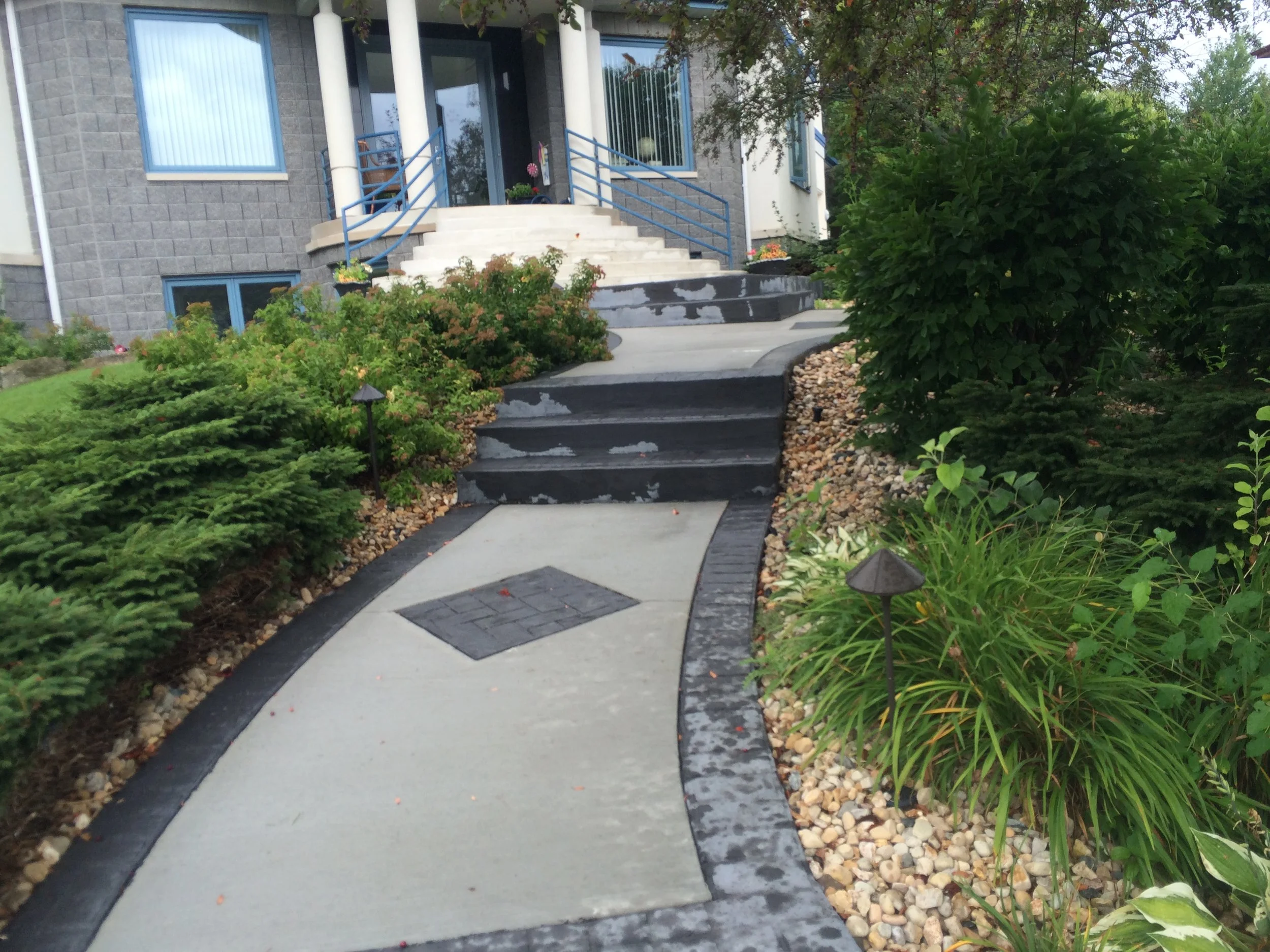 Poured Concrete with Colored Stamped "Brick" Edge and Inlay. For Reference Only. Not AG&L Work