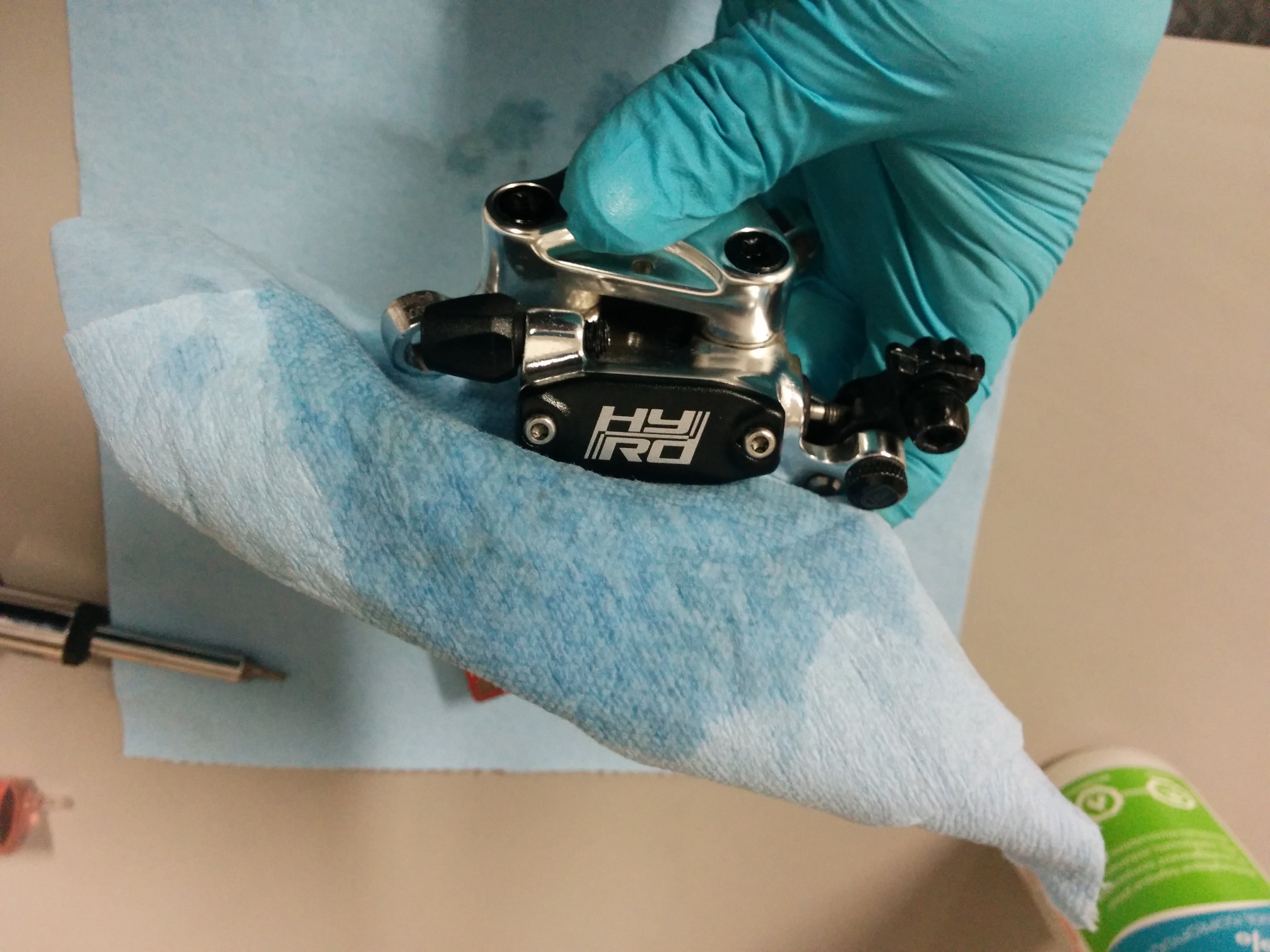 Clean the caliper with alcohol before placing the brake pads.