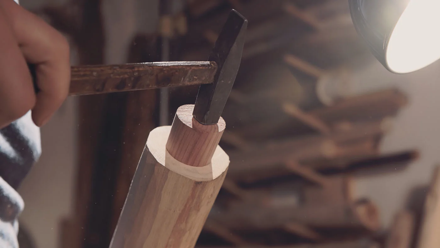 Carefully tapping the juniper block with the second-smallest hammer in my workshop.