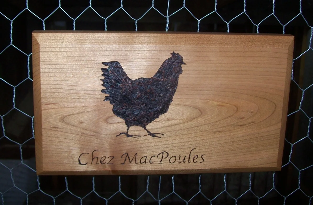  This sign for my parents' chicken coop was my first attempt at pyrograving, the process of using a soldering iron to burn a design into wood. &nbsp;The sign is made out of cherry, finished with Daly's Profin. 