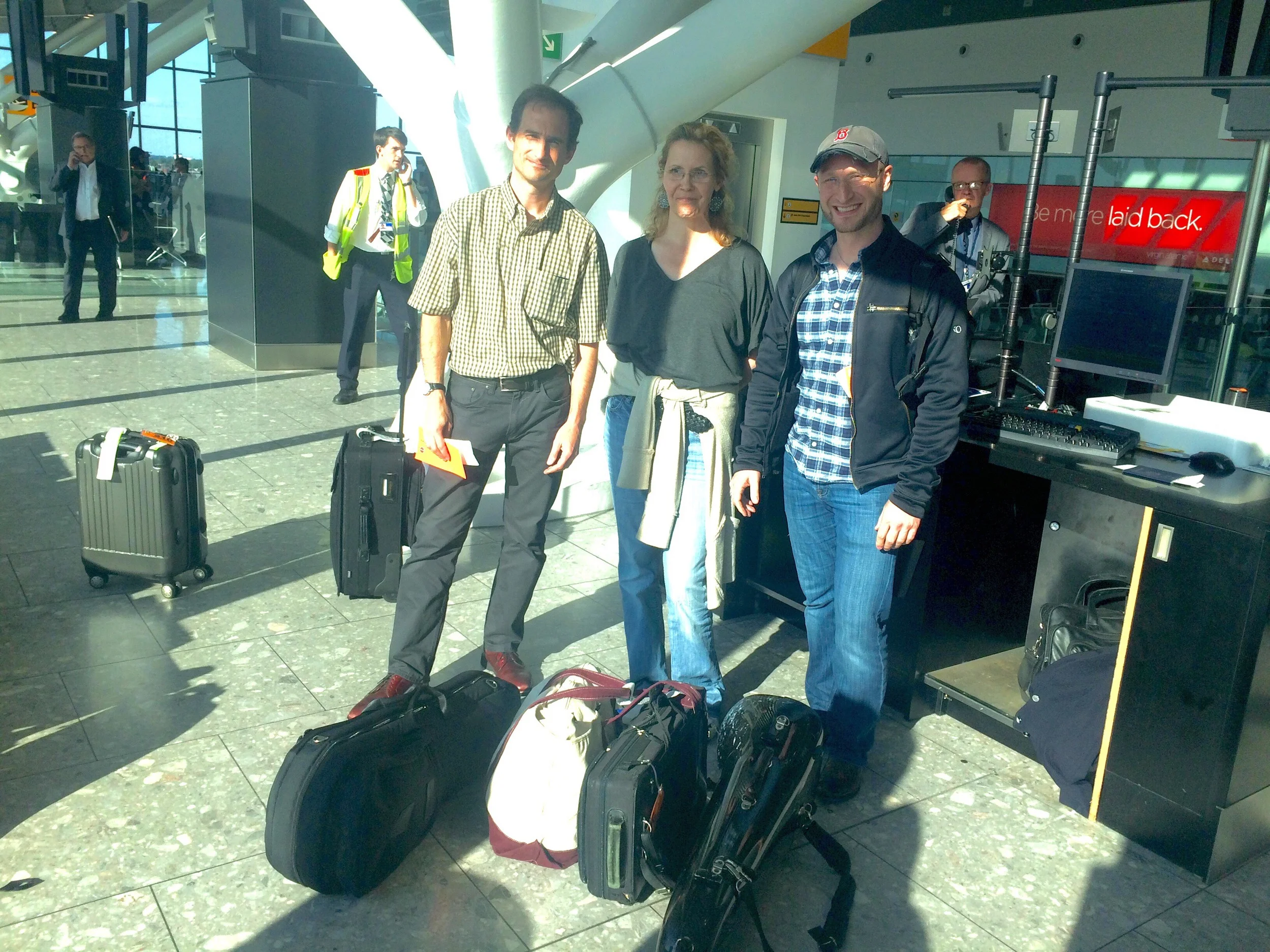 BSO Musicians and their "offending instruments" at the British Airways terminal waiting to board the flight home.