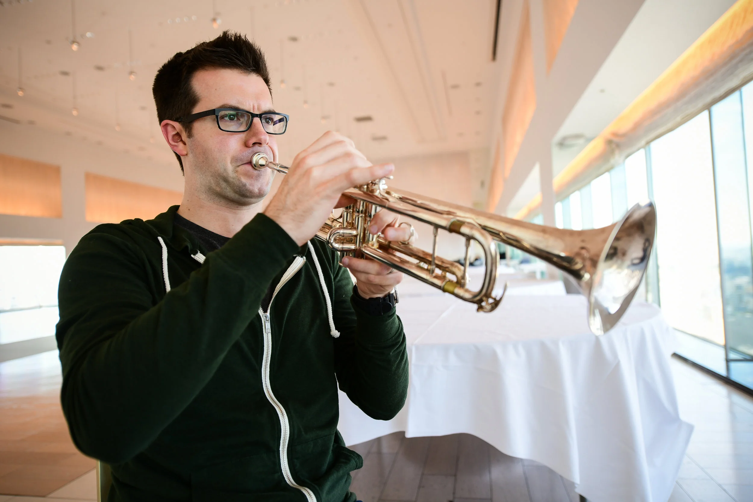 Associate Principal Trumpet, Tom Siders warms up at the beginning of day 1.