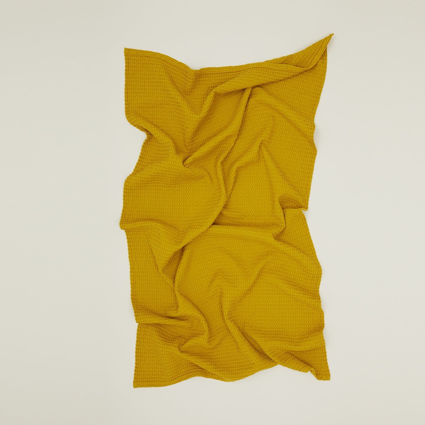 yellow crumpled towel on white background