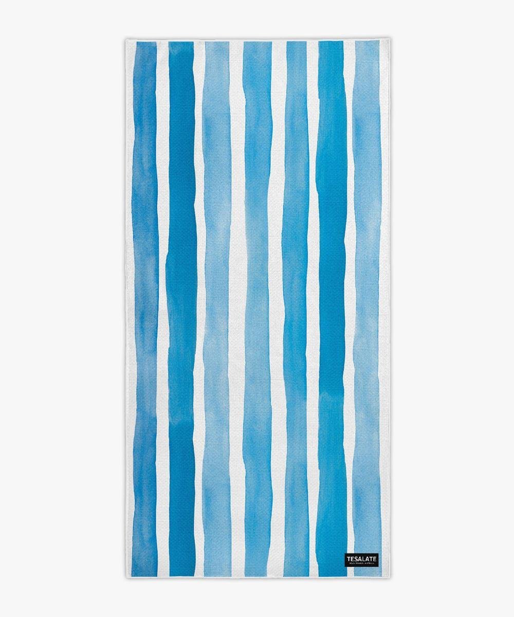 Blue and white striped towel on white background
