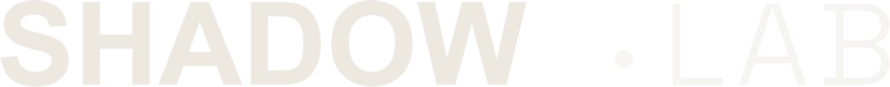 Partial text reading 'SHADOW LAB' in black and white.