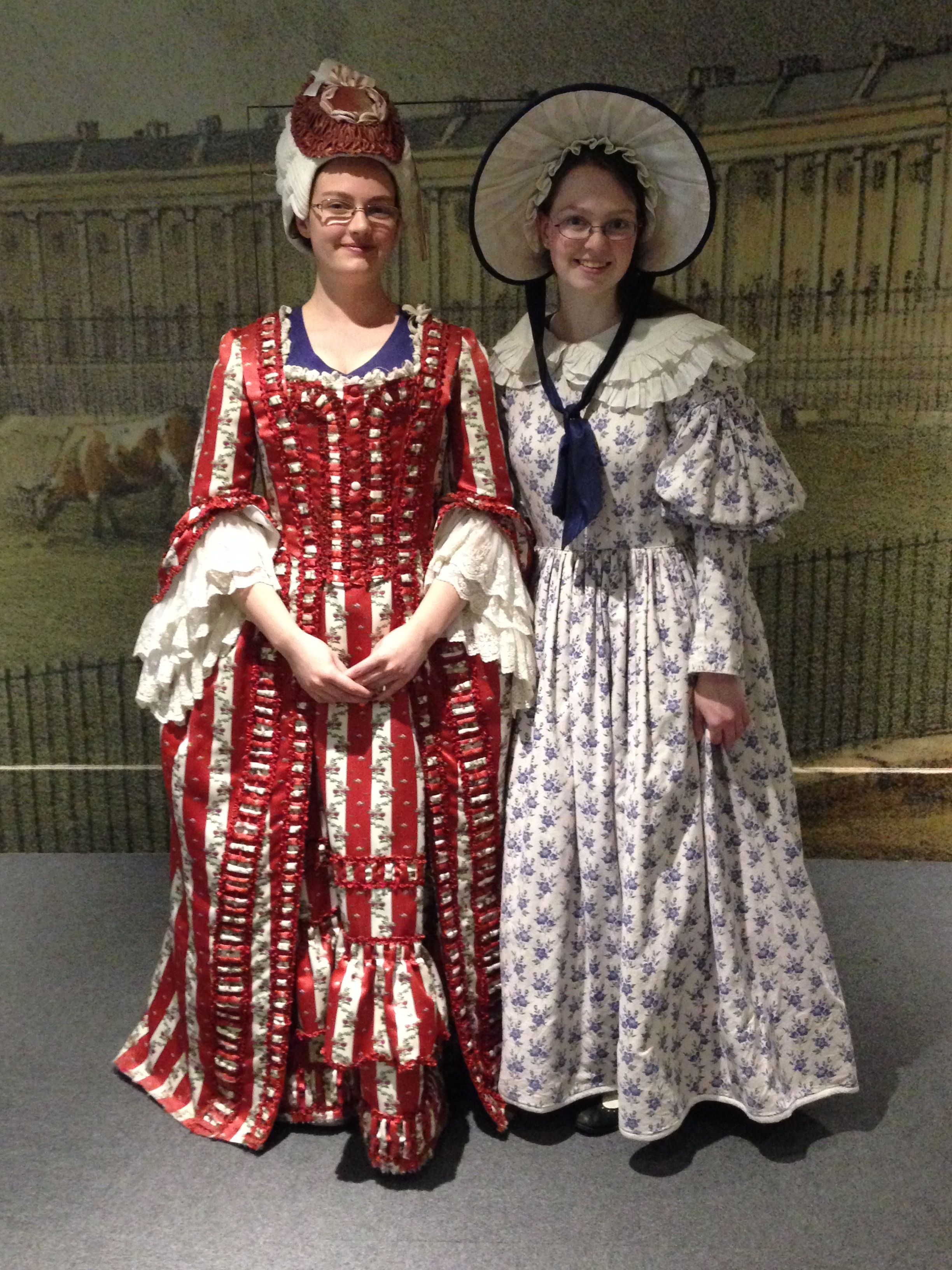  My sister in an 18th-century costume and wig, me in a 19th-century costume and hat. 