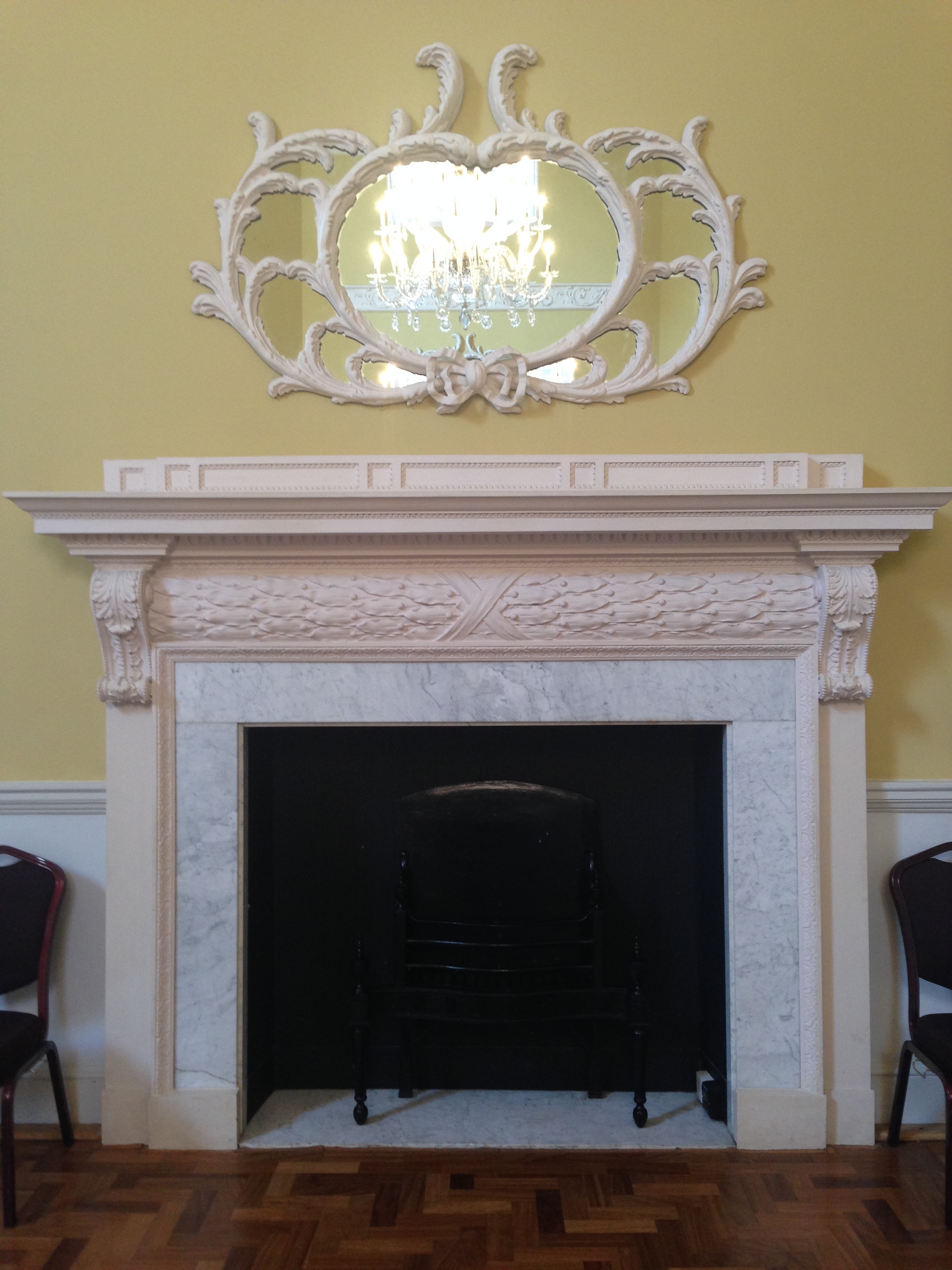  This room couldn't be complete without a lovely mirror and fireplace. 