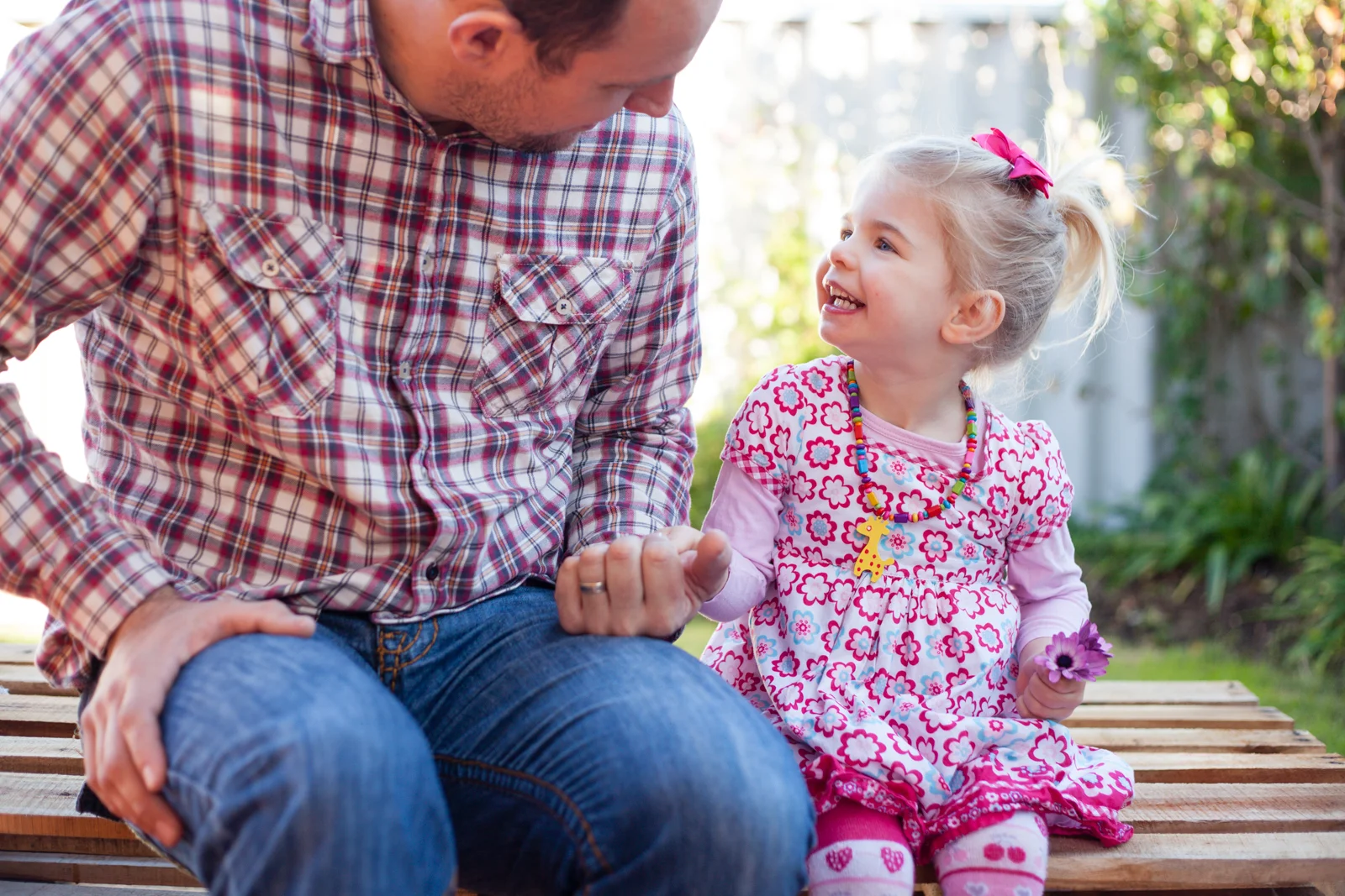 Don't waste your time trying to get them to look at the camera and smile.  Rather give them something to do, and talk to them as they are enjoying it.  I guarantee the expressions will be much more real and beautiful, and the photos will h…