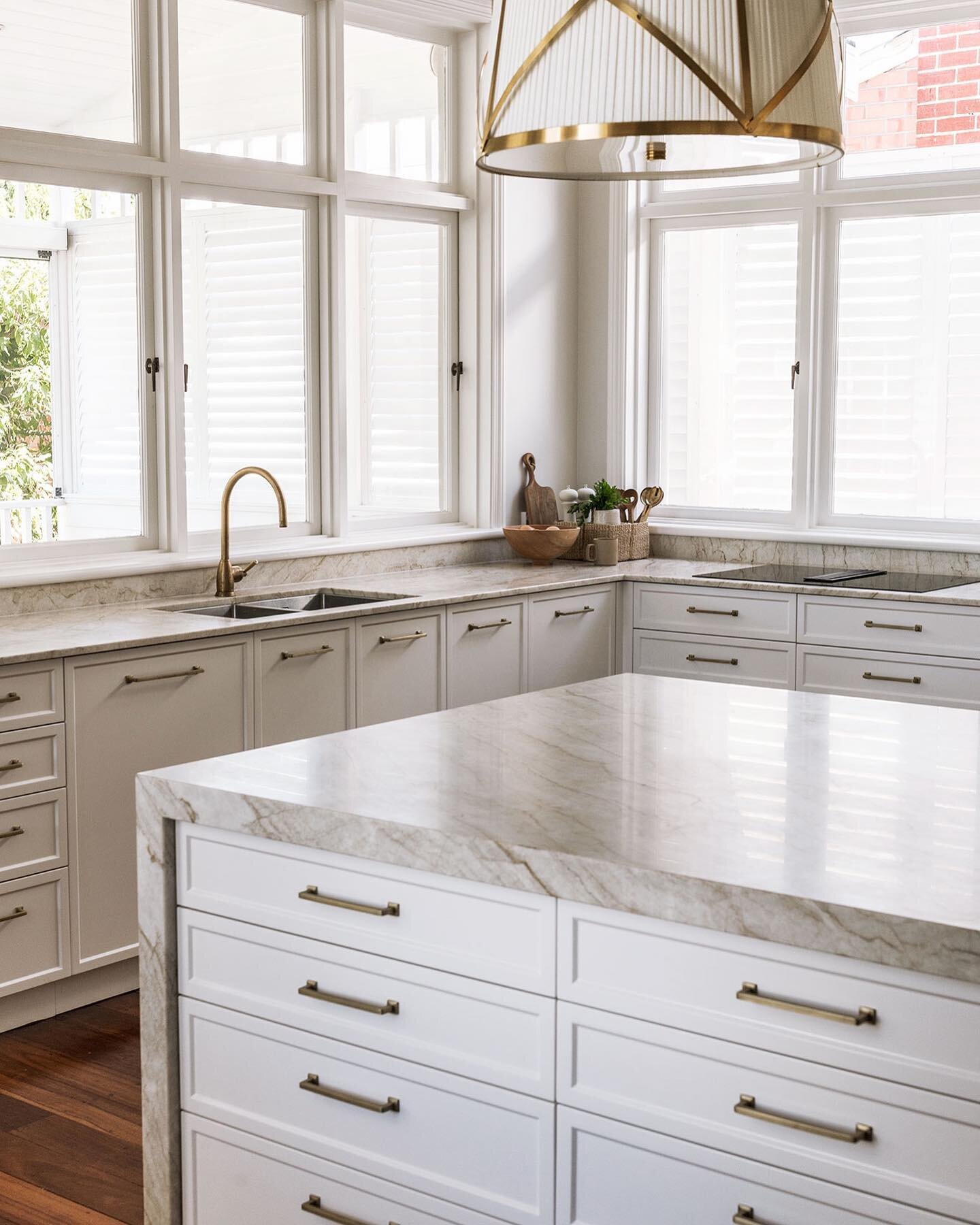 Taj Mahal quartzite benchtops, aged jarrah floors, brass details and lots of natural light. All the details at our Claremont project.

.
.
.
Interior design by @staple_design 
Styling by @staple_design 
Photo by @meghan_plowman 
.
#luxuryhomesperth #