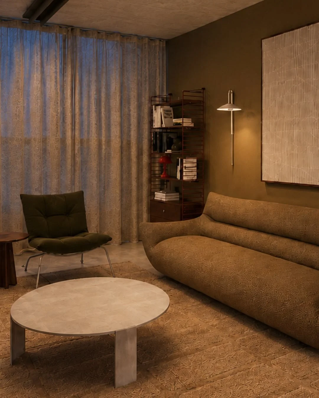 The existing interior had a very strong material palette &mdash; concrete floors and ceilings, masonry and large expanses of glazing.

The new furniture, finishes and window treatments were selected to soften these harder elements without disguising 