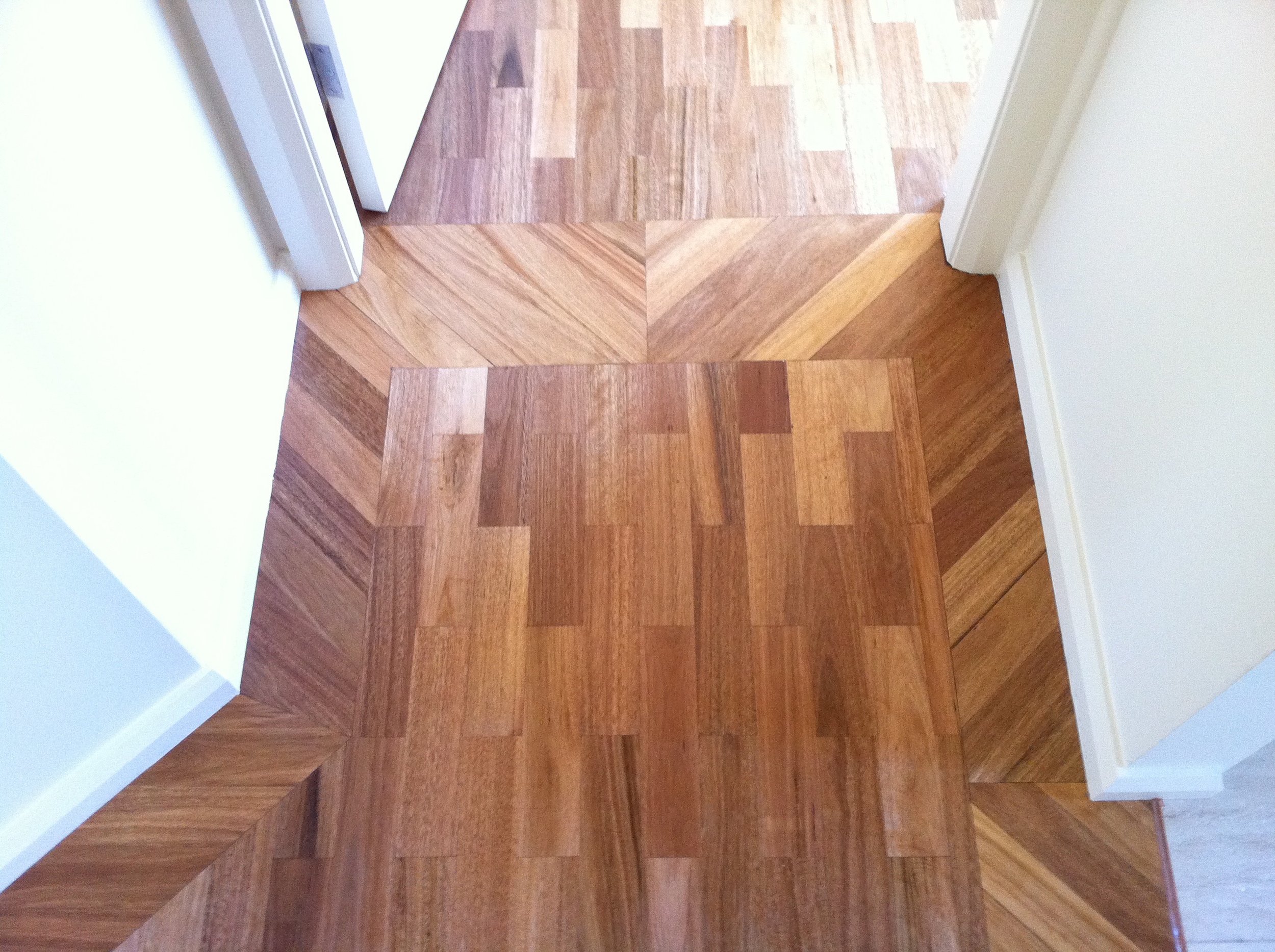  Blackbutt parquet laid in a brickbond pattern with a diagonal solider course border 