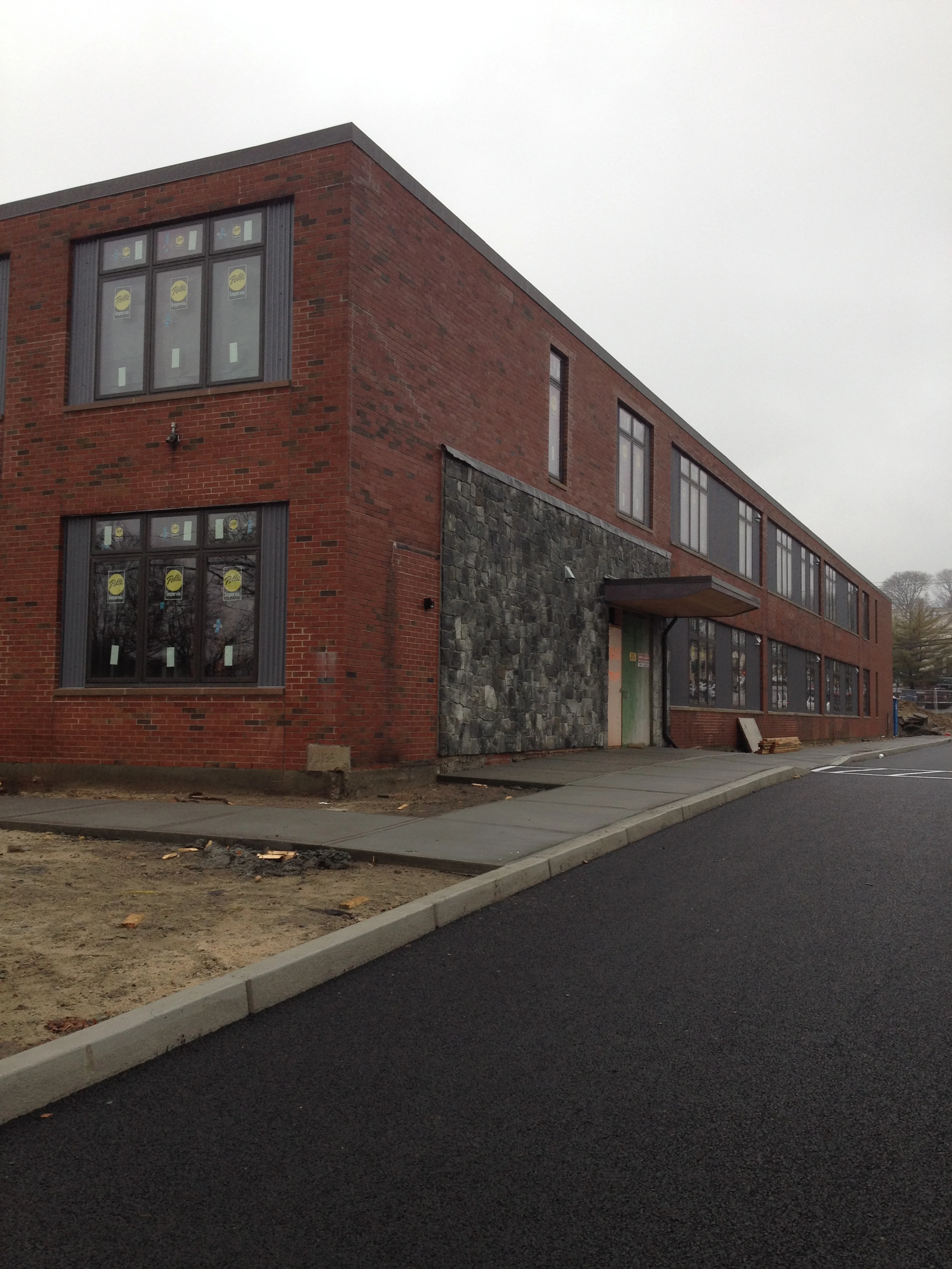 New awning and stonework at front entrance (and permeable asphalt in the parking lot!).
