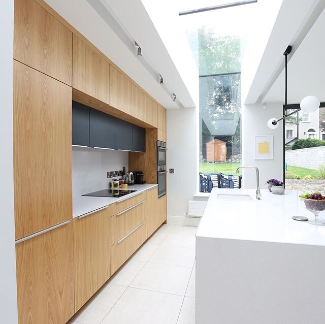 Irish Oak is one of the most beautiful natural woods for adding warmth to a modern kitchen. In this design we used a combination of wood, white and deep navy colours to create a modern design with timeless appeal.