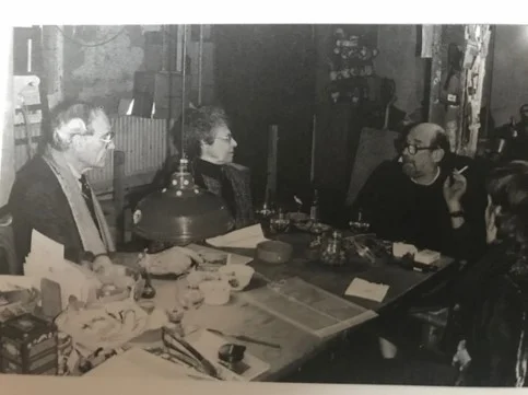 Melvin and Elaine Merians in conversation with Euan Uglow, cigarette in hand