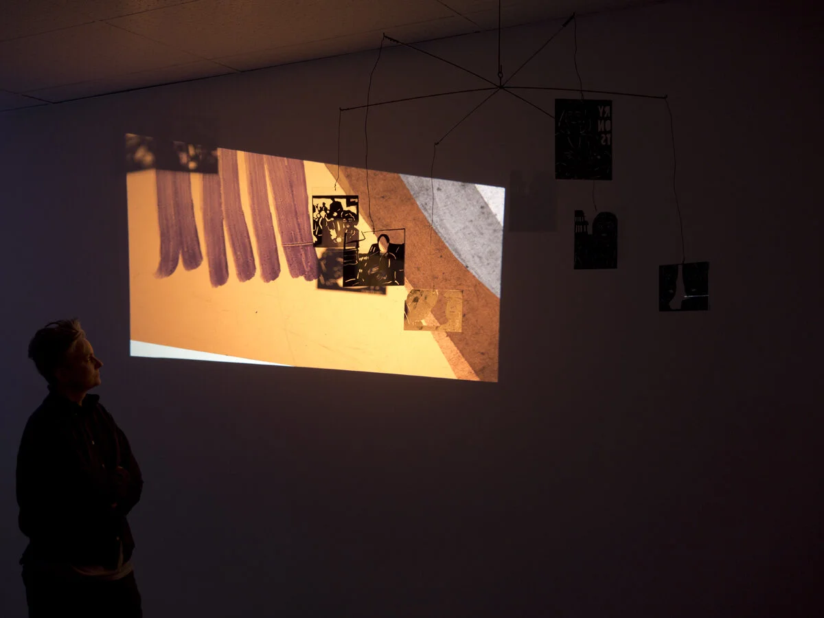 Cassie Riger, news (orange), expanded cinema slide projector, kinetic sculpture