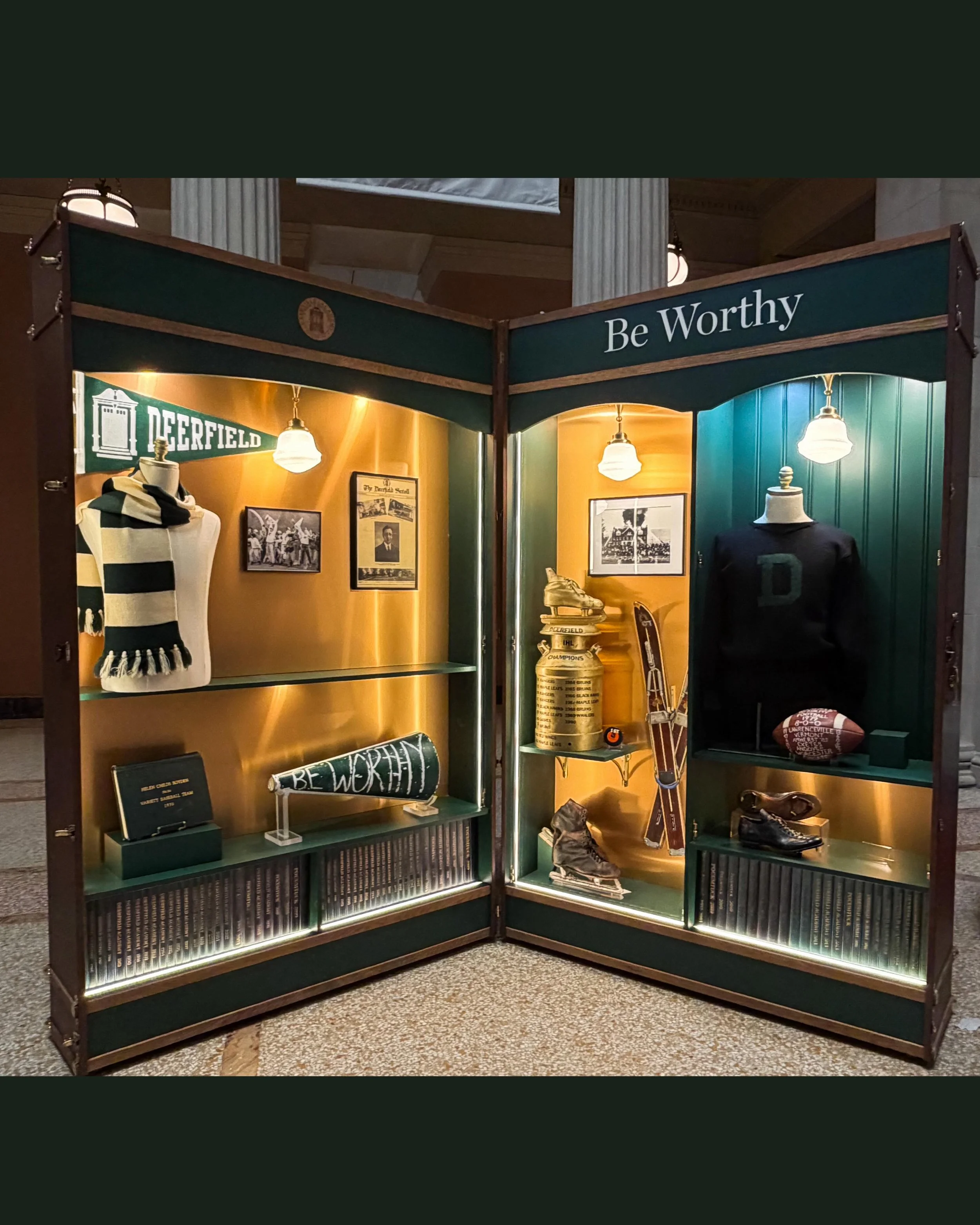 Part 2 of our custom build for @deerfieldacademy 💚features 2 oversized leather trunks with hardwood and brass finishes that open to reveal vintage school memorabilia. One of the cases also features digitized footage from old school events, as well a