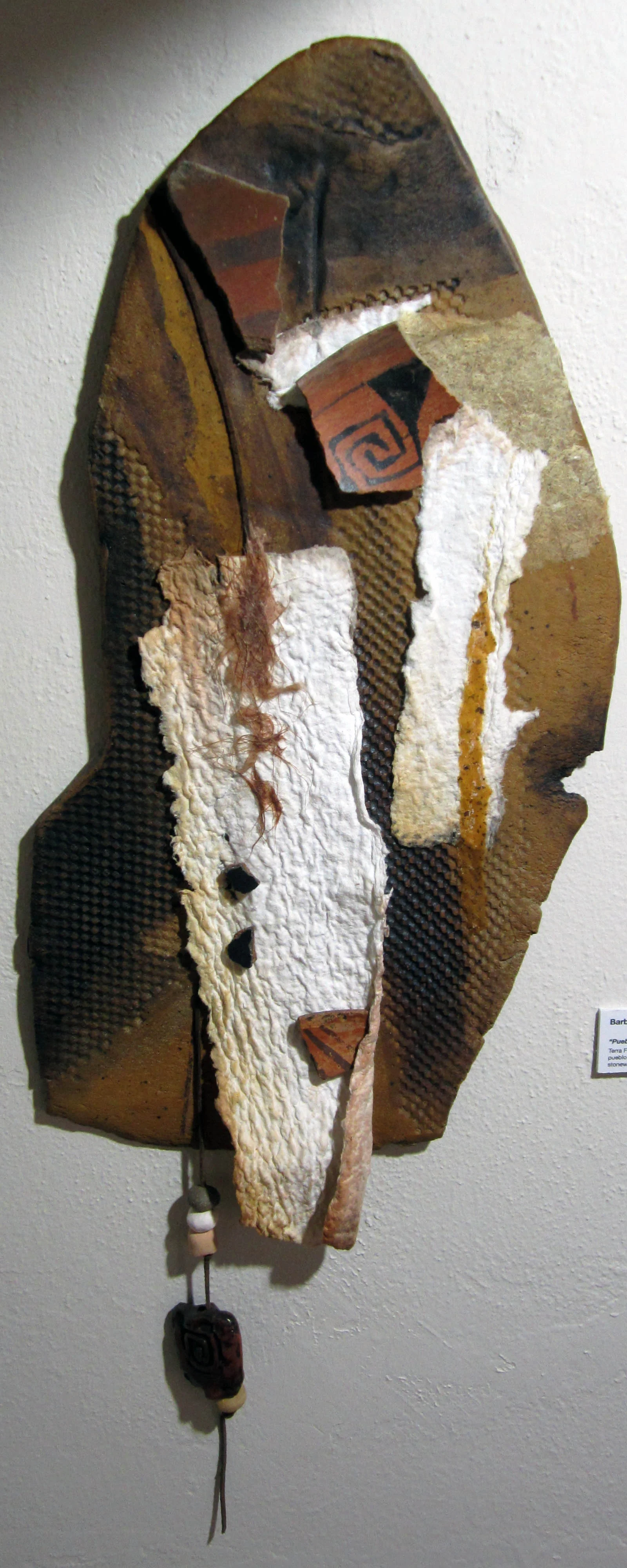 "Pueblo Pieces" Terraform $300 Consists of handmade paper, clay beads, early Pueblo shards (found on private land, rice papaer adn watercolors, and is attached to stoneware clay. The piece has been sealed with UV Protective spray. SOLD