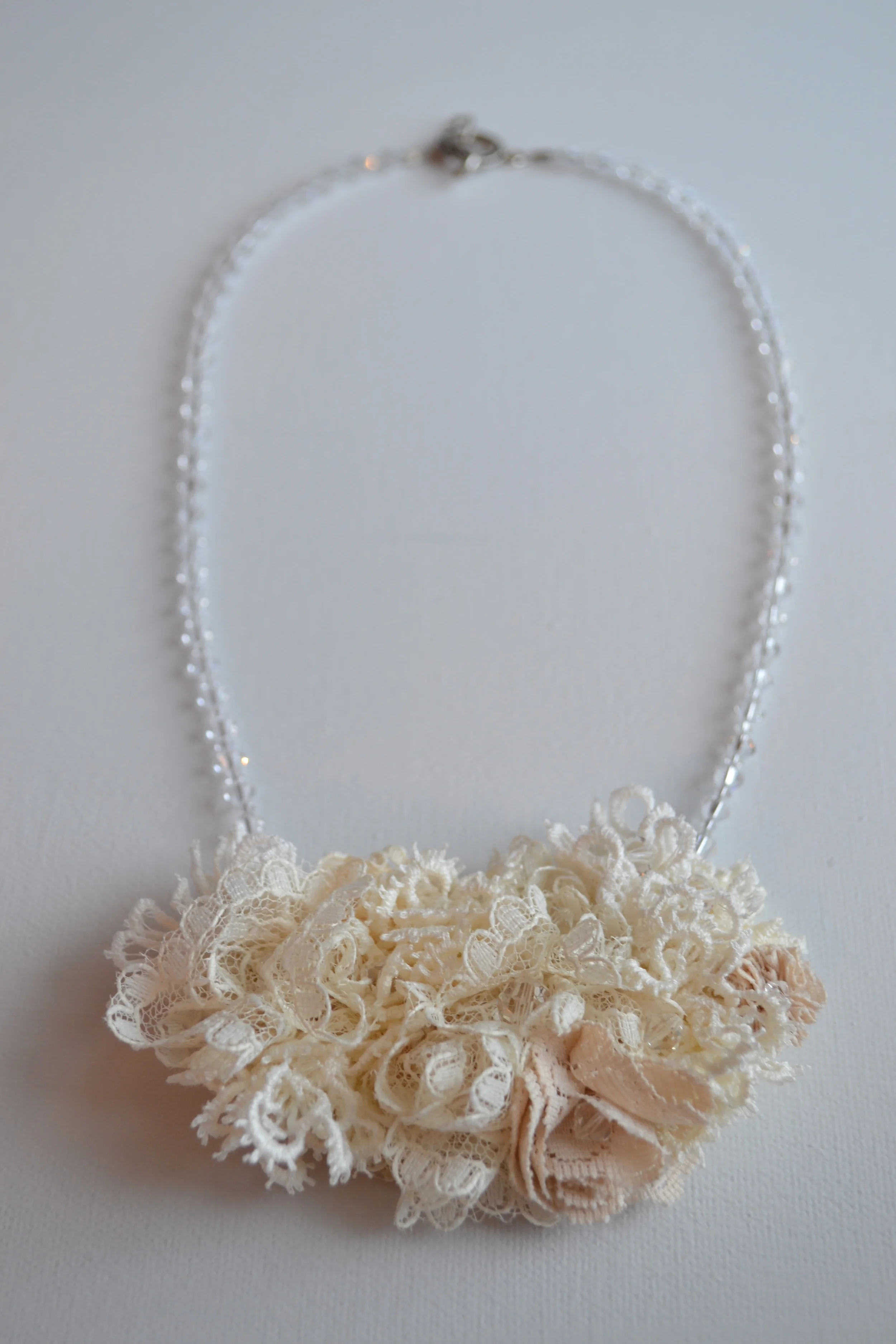 Bouquet style necklace from L.E.W. designs. Vintage beige lace and crystals. Handmade. Click through for more information. (3).JPG